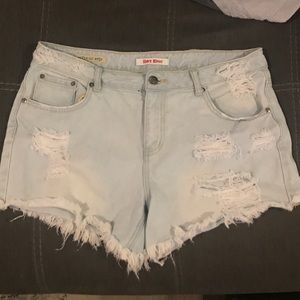 Mid rise distressed denim shorts